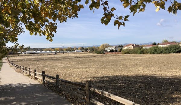 View of Lowell property (Clear Creek Valley) and adjacent housing near pathway
